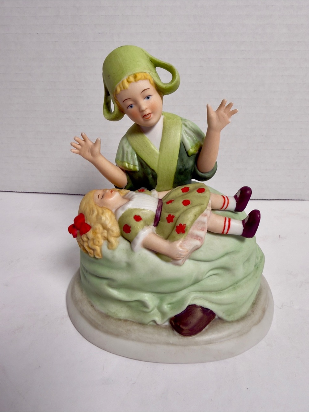 Danbury Mint Porcelain Figurine in Green, Cream and Red Accents